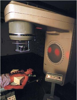 Man undergoing radiation treatment for Hodgkin's disease, a cancer of the lymphatic tissue. The areas to be irradiated appear as illuminated circles on the patient's body. (Reproduced by permission of Photo Researchers, Inc.)