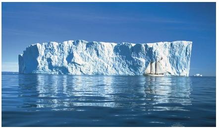 An iceberg in Disko Bay on the western coast of Greenland. (Reproduced by permission of The Stock Market.)