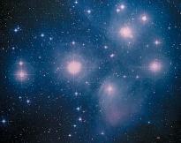 The Pleiades open star cluster (M45), situated in the constellation Taurus. The Pleiades cluster is about 400 light-years from Earth and is young (only about 50 million years old) on a galactic time scale. (Reproduced by permission of Photo Researchers, Inc.)