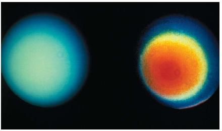 Unlike other gas giants, Uranus doesn't reveal many atmospheric features in visible light. However, latitudinal (side-to-side) atmospheric bands do exist, as can be seen in the enhanced image on the right. Because Uranus rotates nearly on its side, atmospheric bands that cross the planet's surface appear as concentric circles in the photo. (Reproduced by permission of National Aeronautics and Space Administration.)